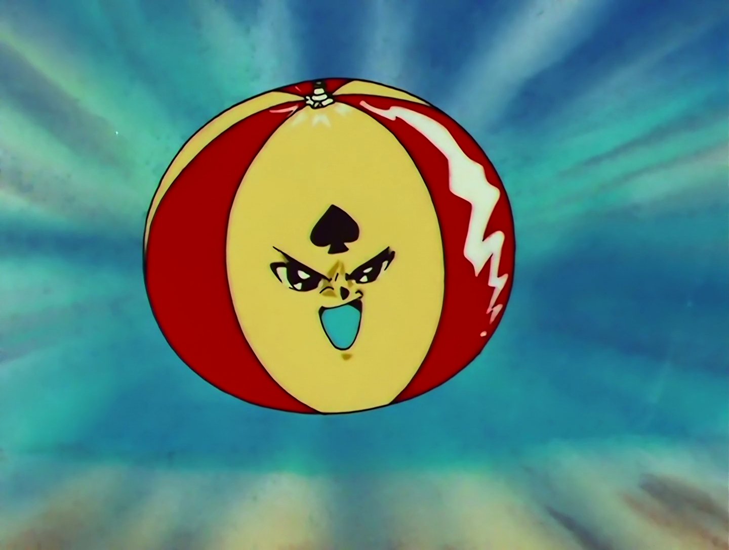 Gum Mario, a Lemures from Sailor Moon episode 140. He looks like a red and yellow beach ball with a face, and a black spade symbol on his forehead. He is just a ball, which is weird and unsettling, but nothing compared to what comes next.